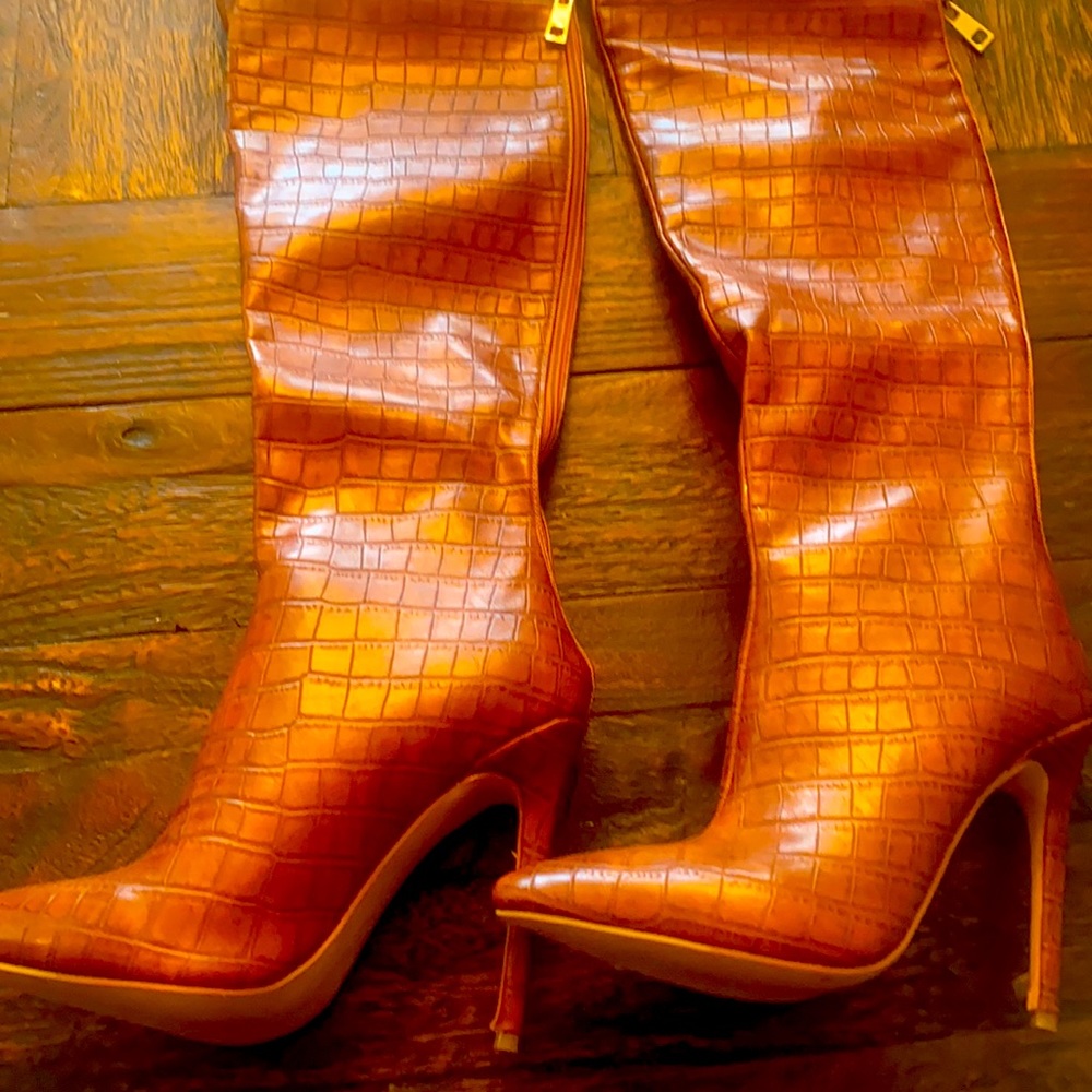 Never worn over the knee brown leather boots with a 4 inch heel